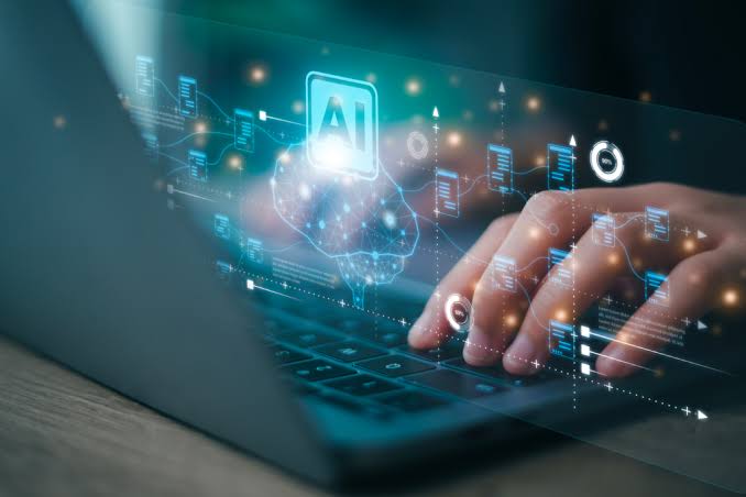 Hands typing on a laptop with an AI interface over the screen